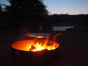 campfire with lake in background