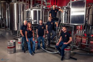 The family posing in the brewery