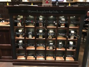 A collection of beer steins inside of cubby's for locals.