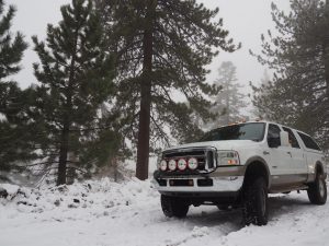 Truck parked in the snow.