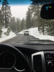 Truck on snowy road.