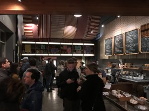 A line of people waiting to order ice cream.