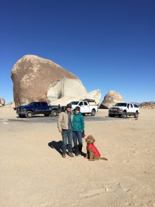 Caitlin, Tucker, and Oakley on a camping trip in the desert.