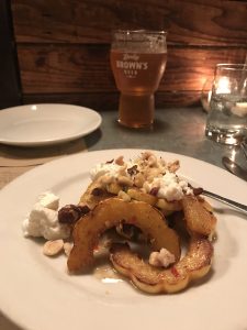 A small plate filled with delicata squash and goat cheese.