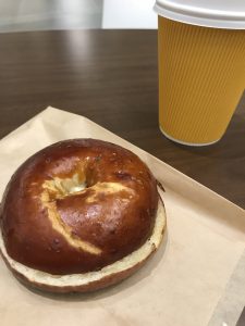 A bagel and a cup of coffee.