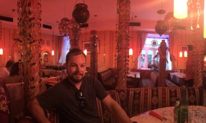 Tucker at an Indian restaurant in Austria.