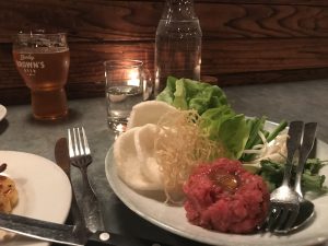 A plate of steak tartare. 