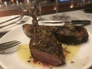 Two lamb chops on a plate.