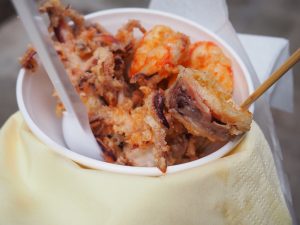 A bowl of fried seafood.