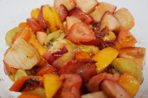 Assorted fruits in a bowl.