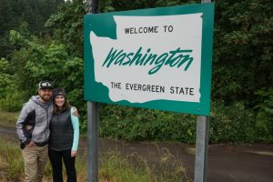 Posing in front of the Washington State sign.