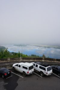 A view of the Hood River with clouds in the reflection.