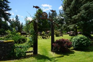 An open field filled with sculptures made of iron.