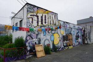 The outside graffitied wall of Storm Brewing in Vancouver, Canada.