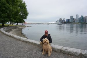 Tucker and Oakley posing in front of the Vancouver skyline.