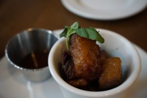 A close-up photo of pork belly bites.