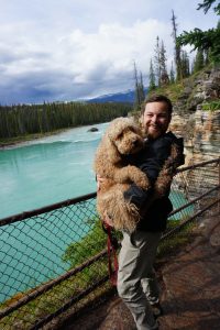 Tucker and Oakley in front of a turquoise river.