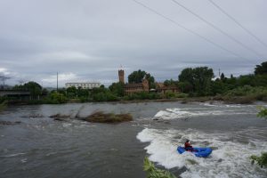 A rafter floating down a river in Missoula.