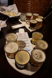 Six small glasses of beer at Quarry Brewing Company.