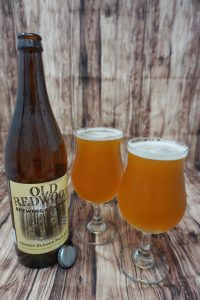 A bottle of Old Redwood's Pale Ale with two full glasses.