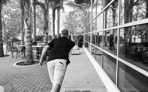 Man throwing a bean bag during a game of cornhole