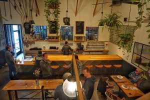 An arial view of the taproom with people throughout.