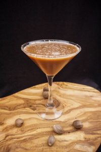 The black flip cocktail in a martini glass