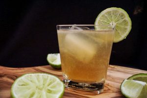 A moscow mule surrounded with lime wedges