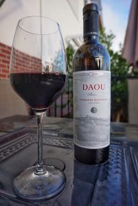 A glass and a bottle of Cab from DAOU.