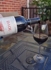 Pouring the DAOU Cabernet Sauvignon into a glass.