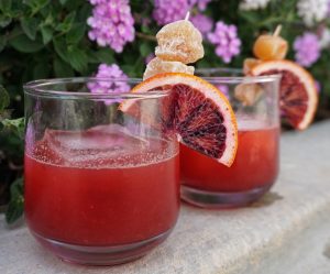 Picture of two Notorious BBG cocktails with blood orange, bourbon, and ginger