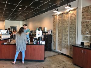 A woman ordering a coffee at the Five07 coffee bar.