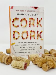 Photo of "Cork Dork" surrounded by corks