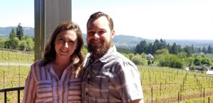 Caitlin and Tucker in front of the Bells Up vineyard.