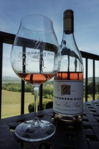 Bottle of Youngberg Hill Rosé alongside a glass.