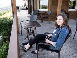 Caitlin sitting on the Youngberg Hill deck.