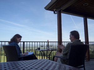 Caitlin and Wayne on the deck at Youngberg Hill during wine tasting.