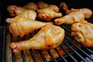 Drumsticks on the grill as they are finishing cooking.