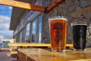 Two beers on the patio table at Mountain Rambler Brewery