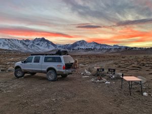 Campsite and truck with sierra nevada mountains in the background