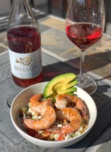 Bottle and glass of Bells Up Prelude Rosé, an Oregon wine from the Willamette Valley, alongside a bowl of Mediterranean Farro Salad (recipe on the blog!).