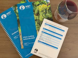 WSET textbooks and a glass of wine