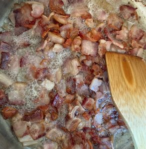 Close up shot of bacon cooking.