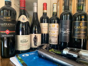 Lineup of 7 wines with a coravin and the WSET textbook.