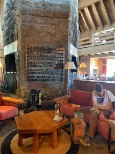 Hiker reloading backpack in the Lodge.