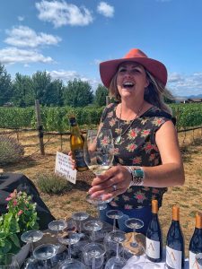 Keely Reed of Wy'East Vineyards pouring Chardonnay for the group.